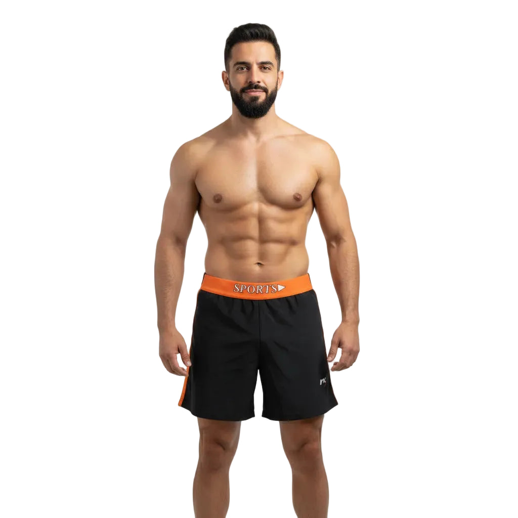 Man wearing black shorts with orange waistband on a light gray background