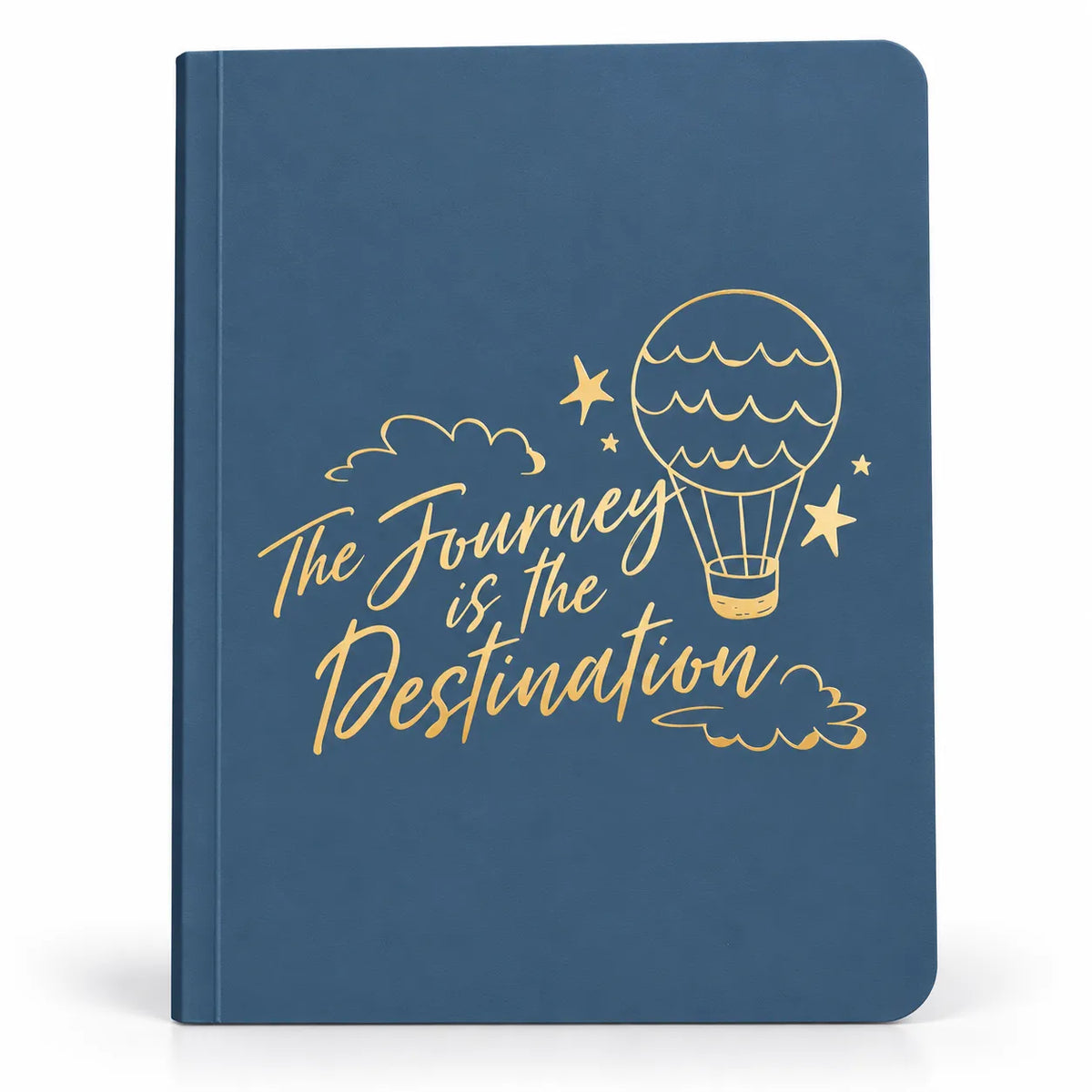 A blue hardcover notebook with gold foil lettering that reads 'The Journey is the Destination' and a gold hot air balloon illustration on the cover, shown against a plain white background.