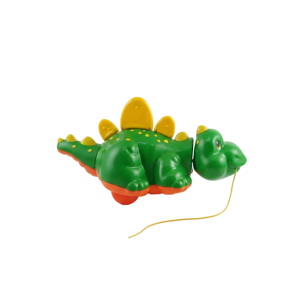 Toy Crocodile  with a yellow string on a white background