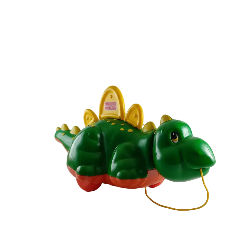 Toy Crocodile with a yellow top and green body on a white background