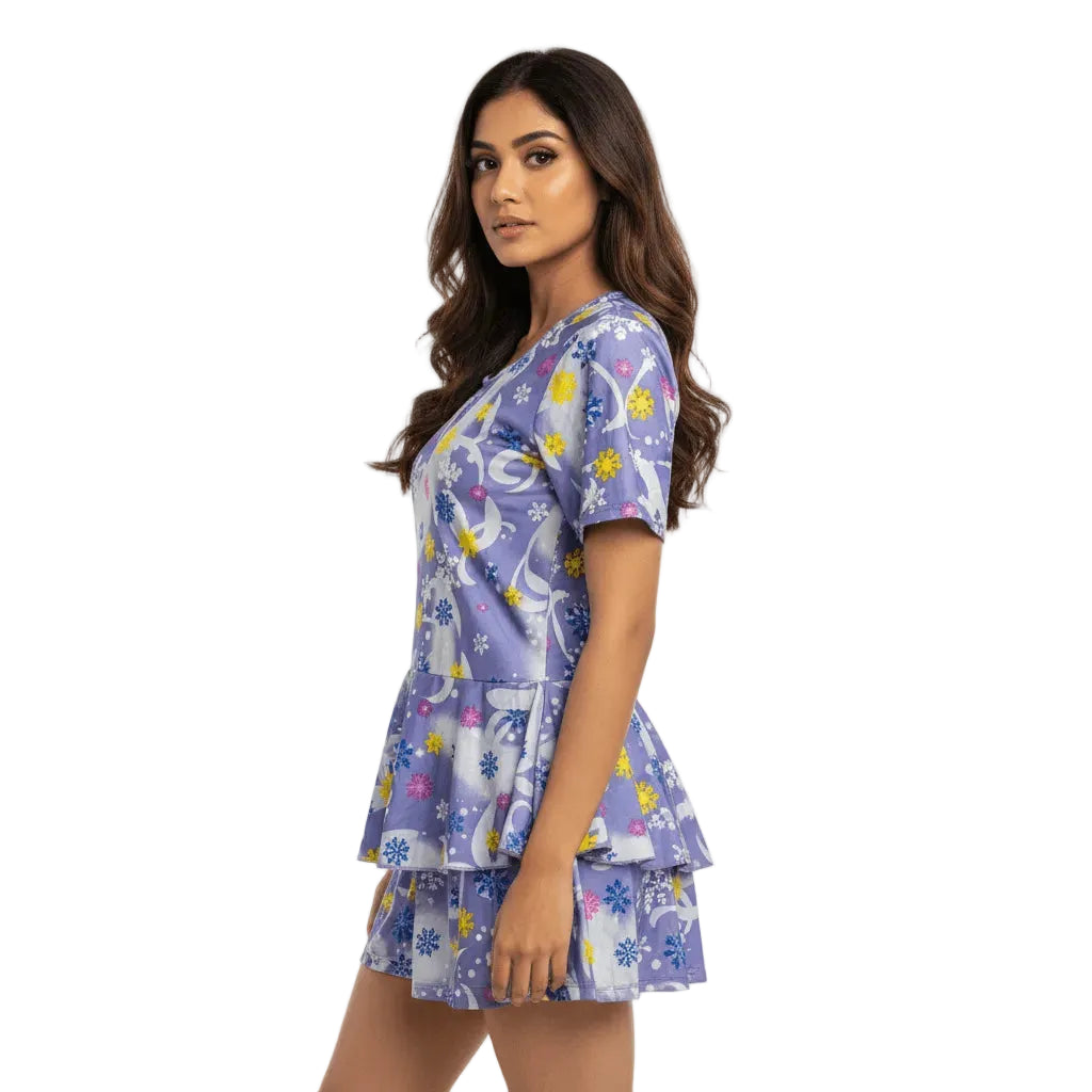 Woman wearing a blue patterned dress on a white background