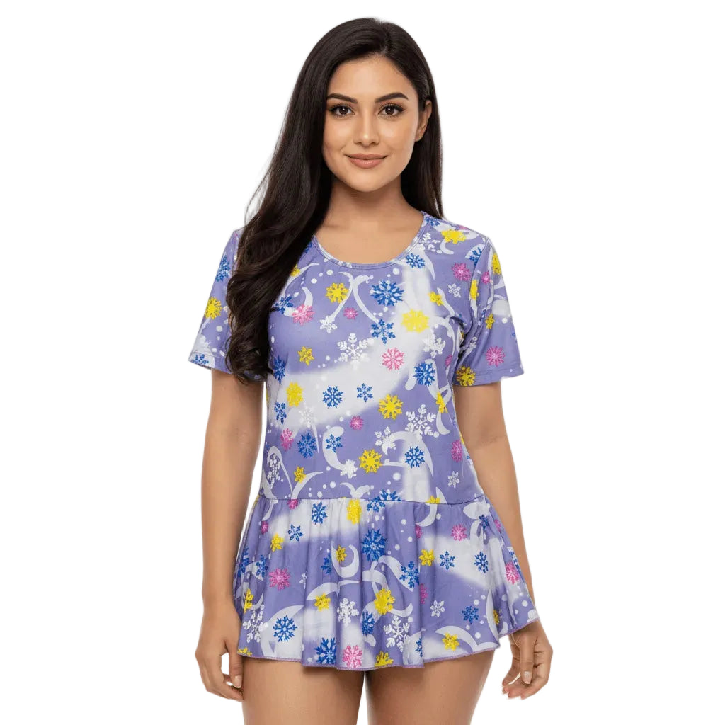 Woman wearing a purple dress with animal and floral pattern on a white background