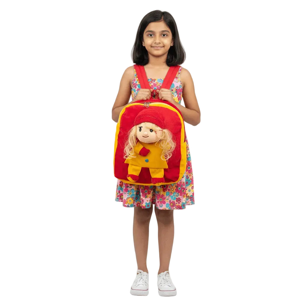 Girl holding a red backpack with a cartoon character on a white background