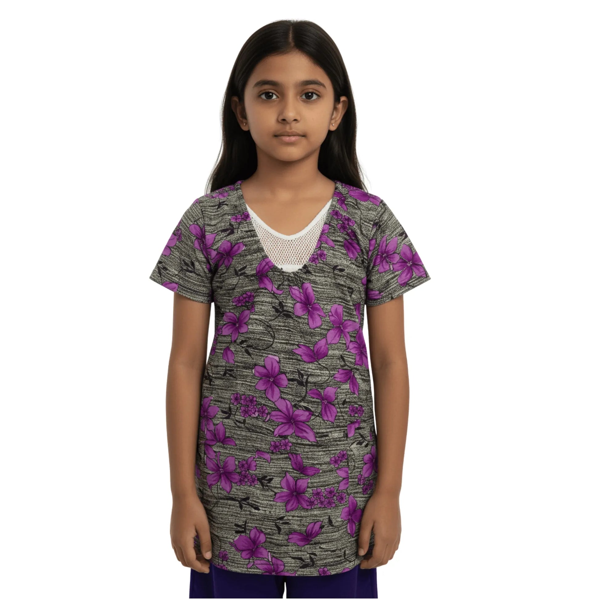 Young girl wearing a floral-patterned shirt on a white background