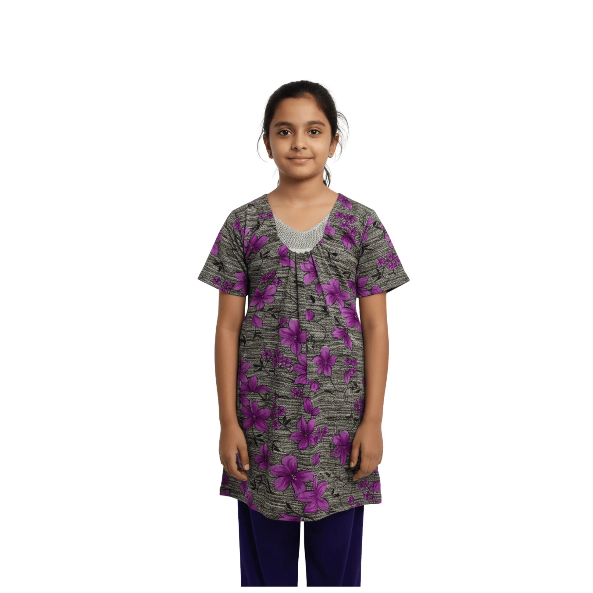 Girl wearing a floral patterned shirt on a white background