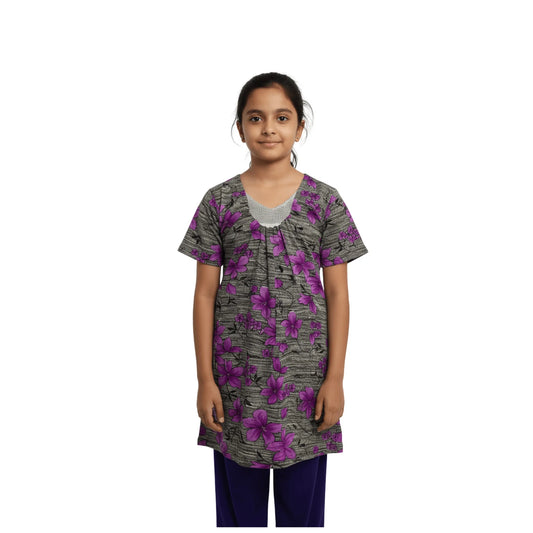 Girl wearing a floral patterned shirt on a white background