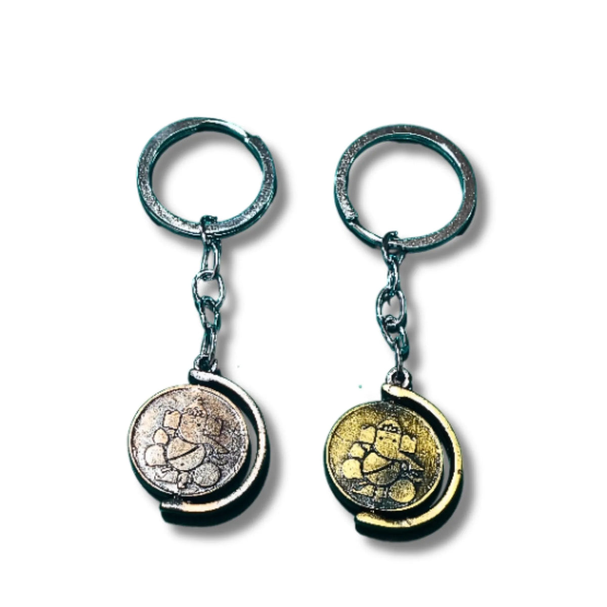 Set of two vintage coin-style keychains with round detailed pendants and metal key rings
