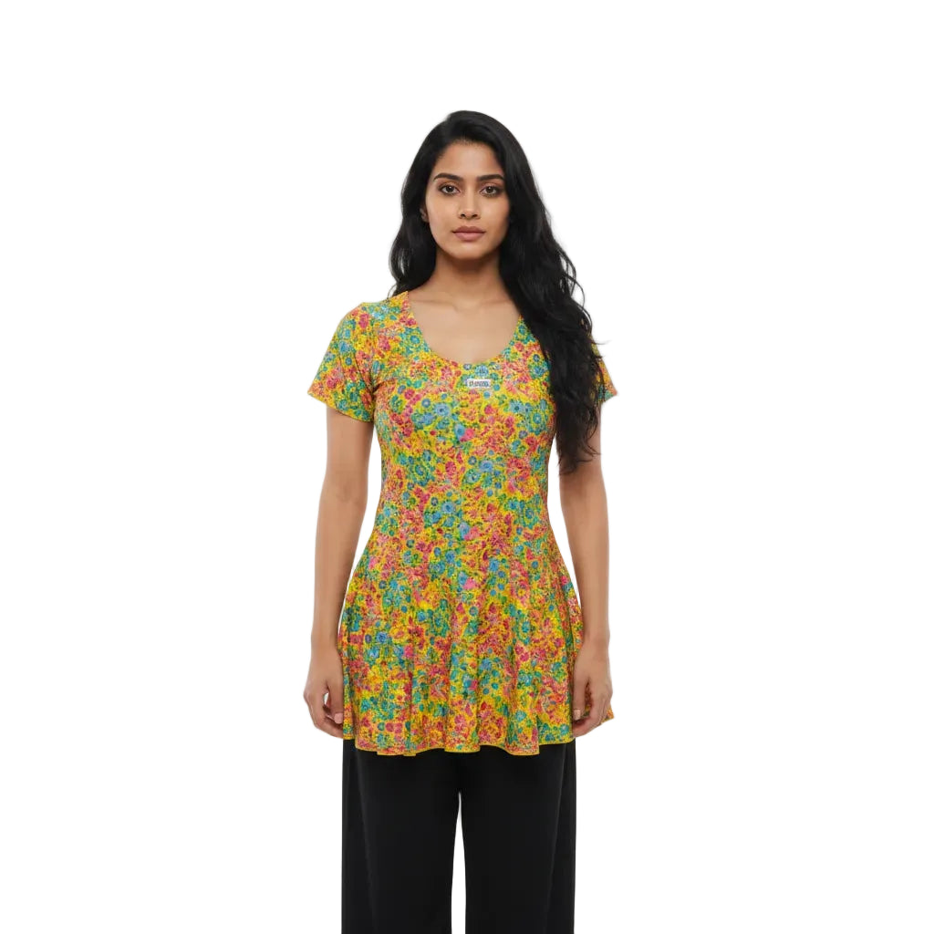 Woman wearing a colorful floral top on a white background