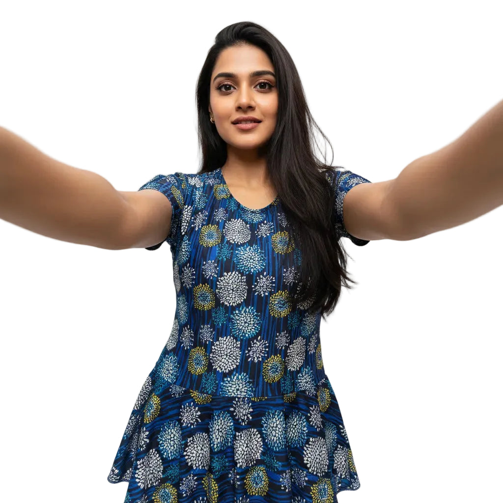 Woman wearing a blue floral dress against a white background