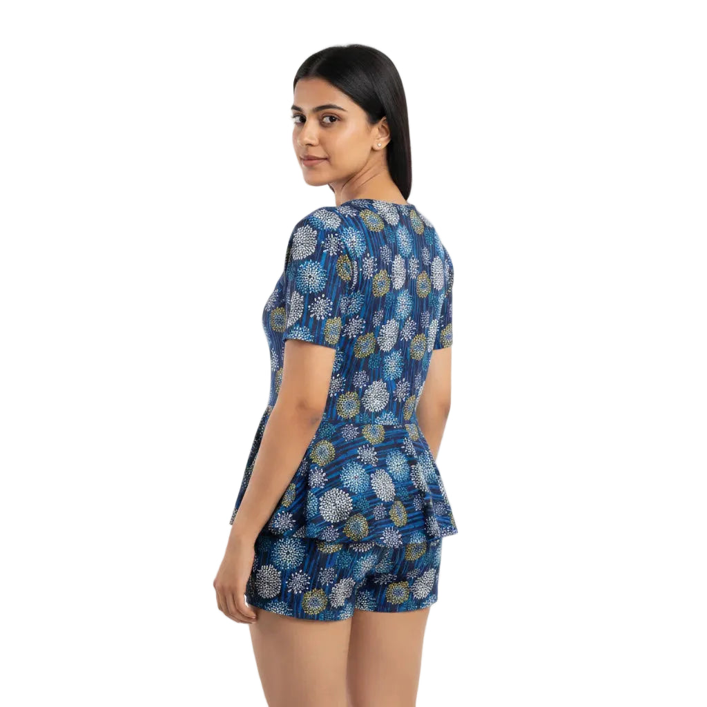 Woman wearing a blue floral dress on a white background