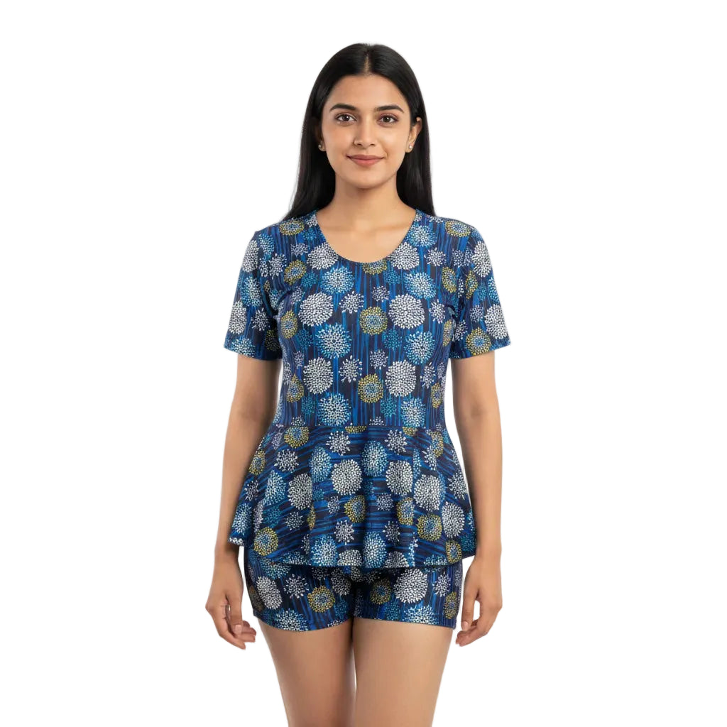 Woman wearing a blue patterned outfit on a white background