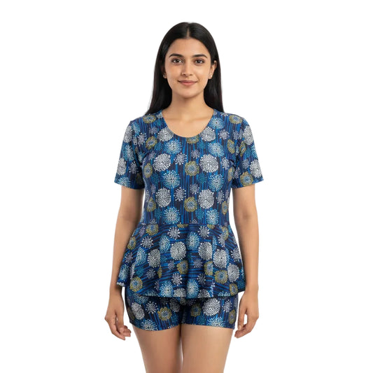 Woman wearing a blue patterned outfit on a white background