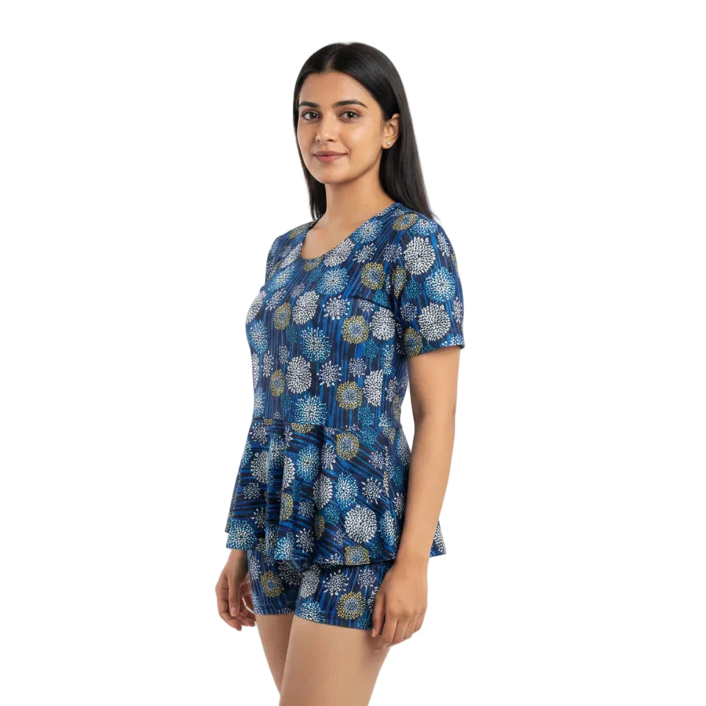 Woman wearing a blue floral dress on a white background