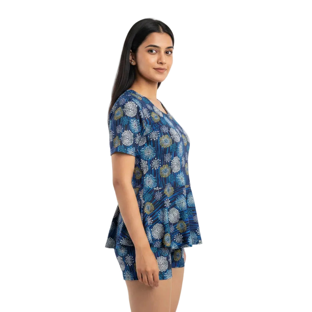 Woman wearing a blue patterned dress on a white background