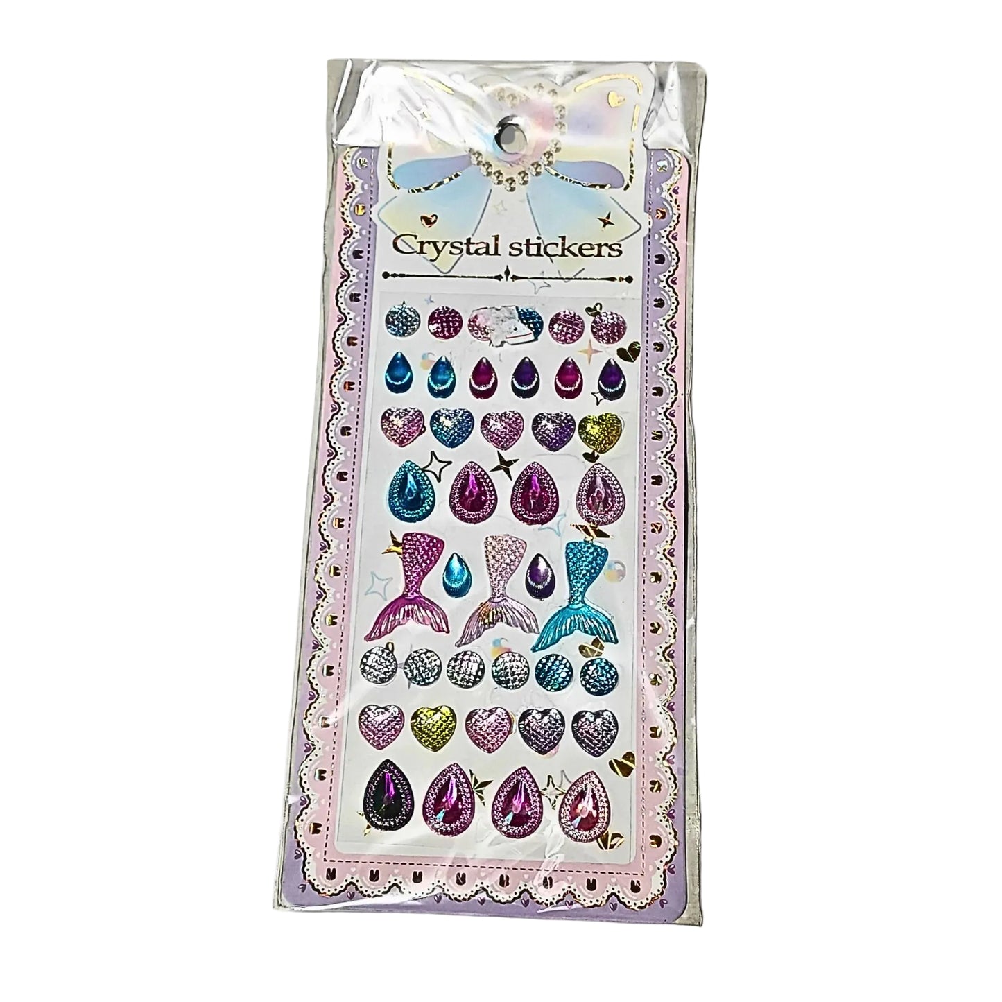 Packaged crystal stickers with various designs on a white background