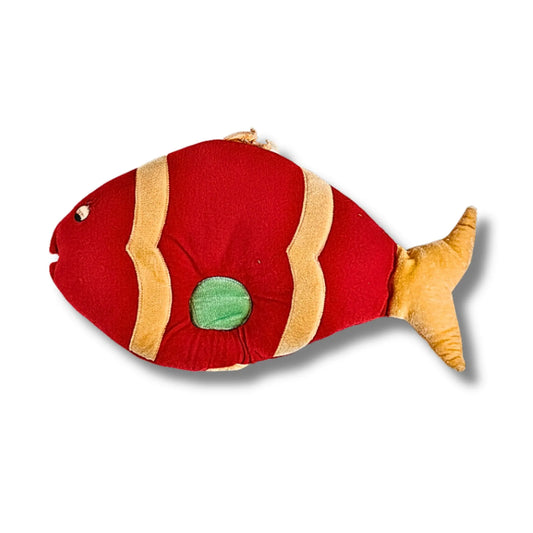 Red fish-shaped plush toy with a green circle on a white background