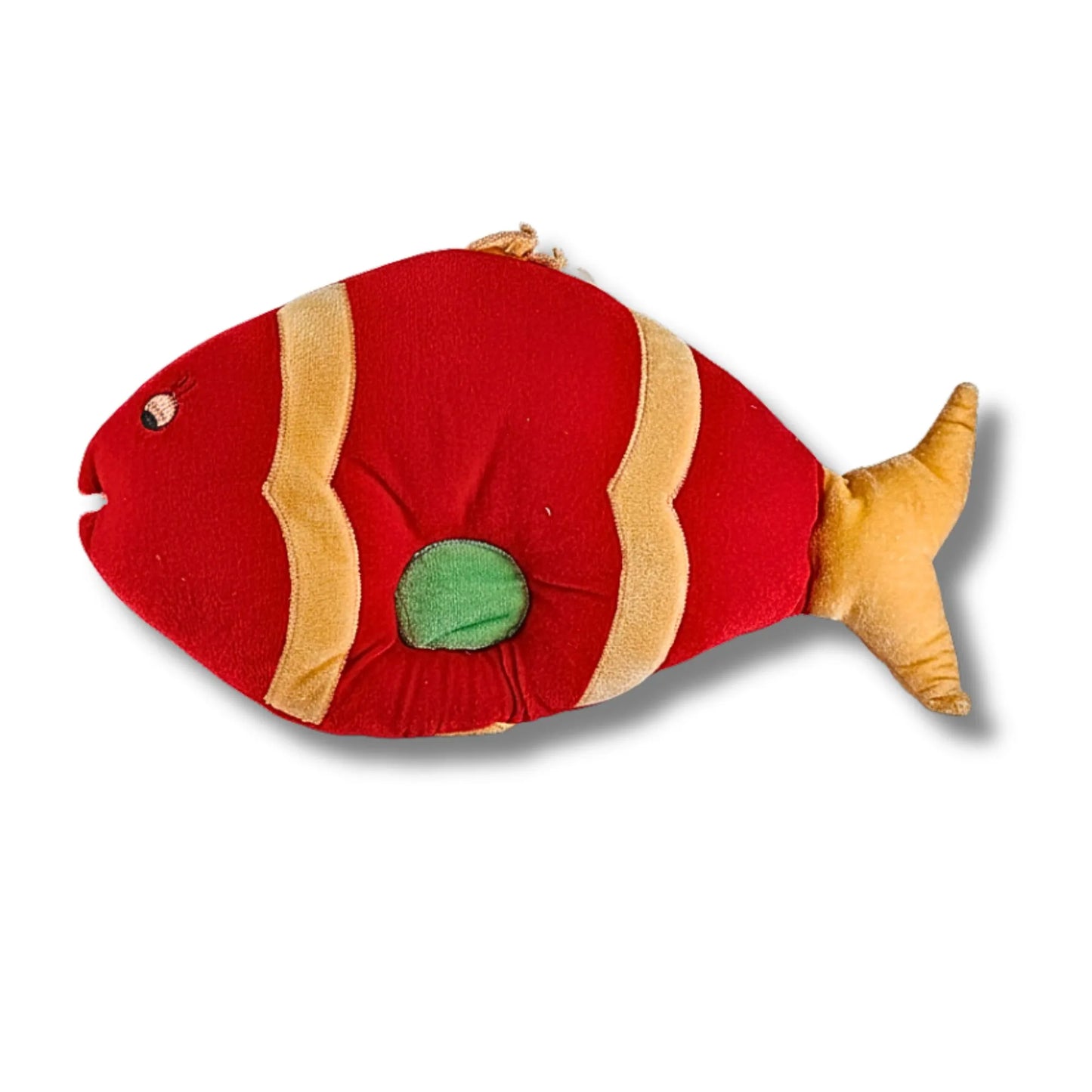 Red and gold fish-shaped toy on a white background