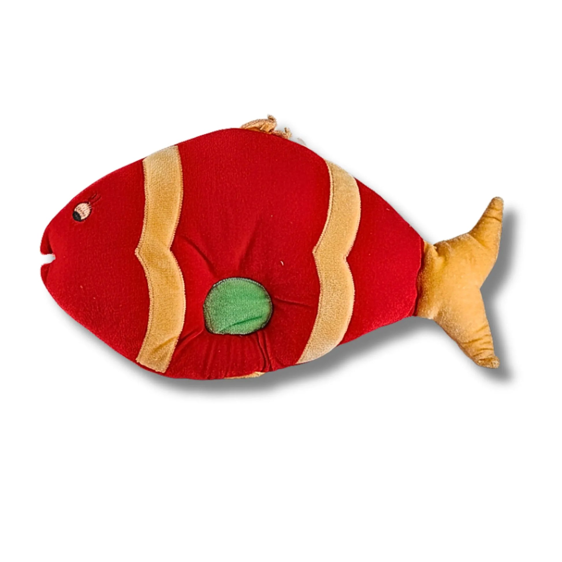 Red and gold fish-shaped toy on a white background