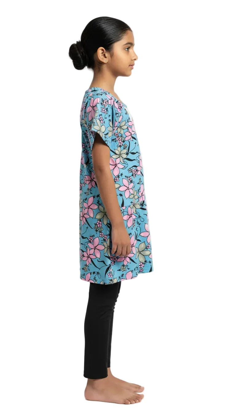 Girl wearing a floral dress on a white background