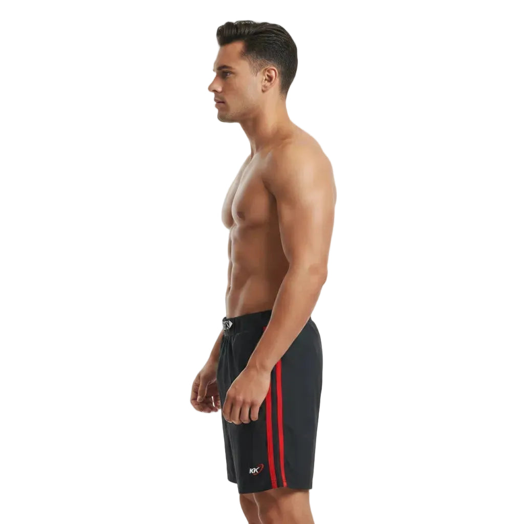 Man wearing black swim shorts with a red stripe on a white background