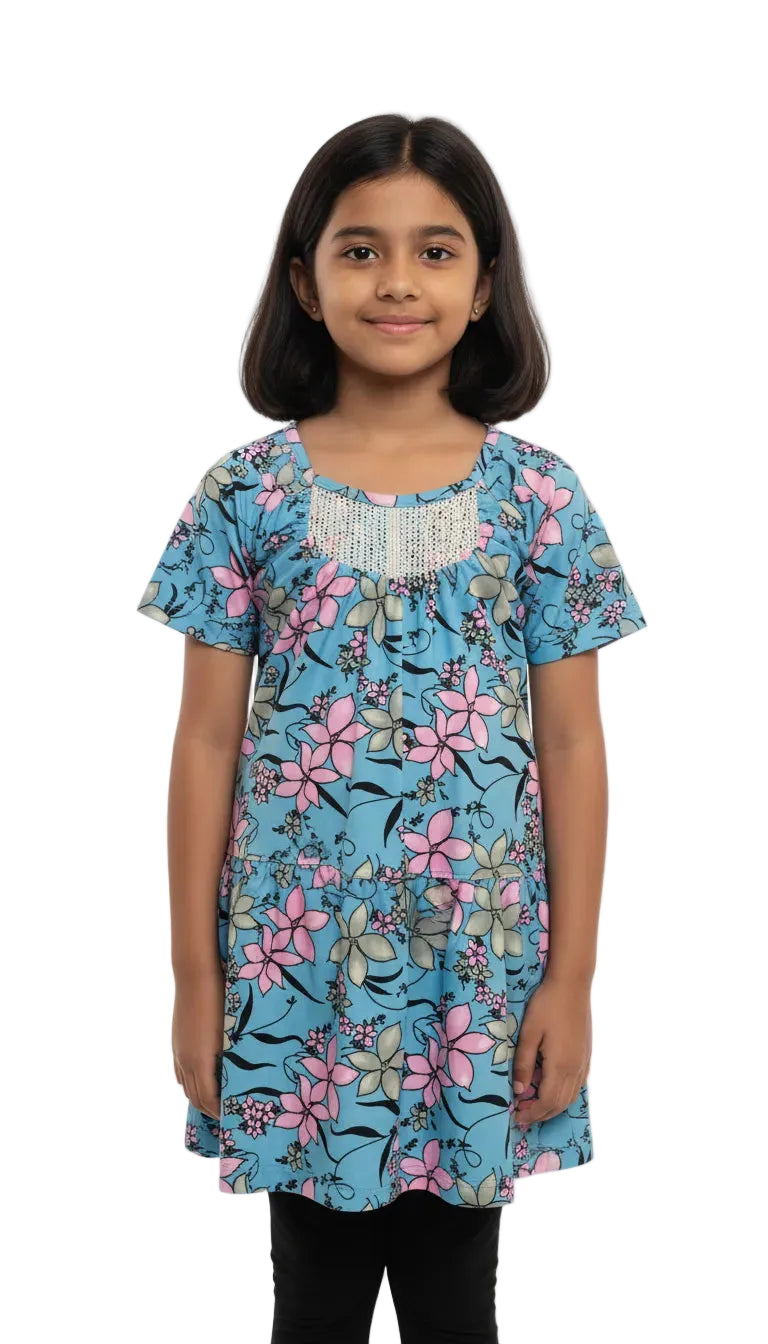 Young girl wearing a blue floral dress on a white background