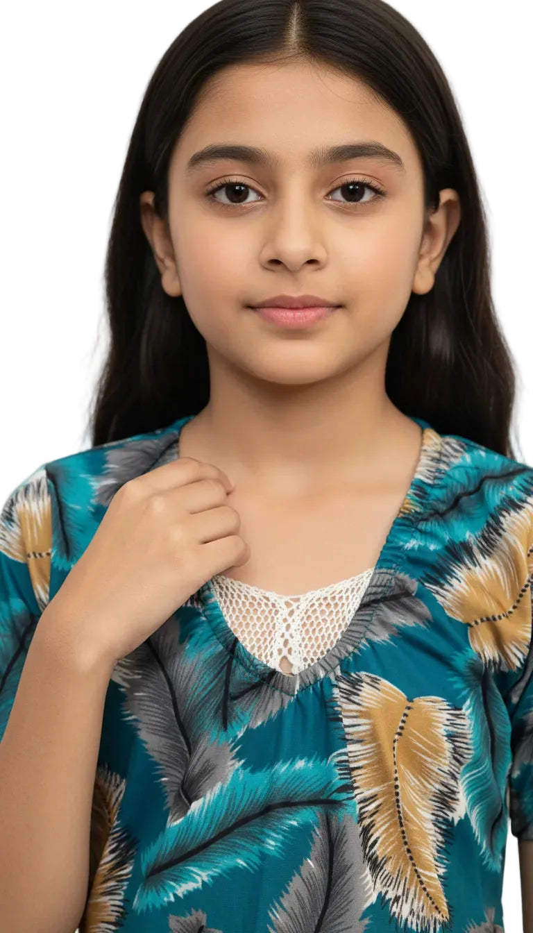 Young girl wearing a colorful patterned dress against a white background